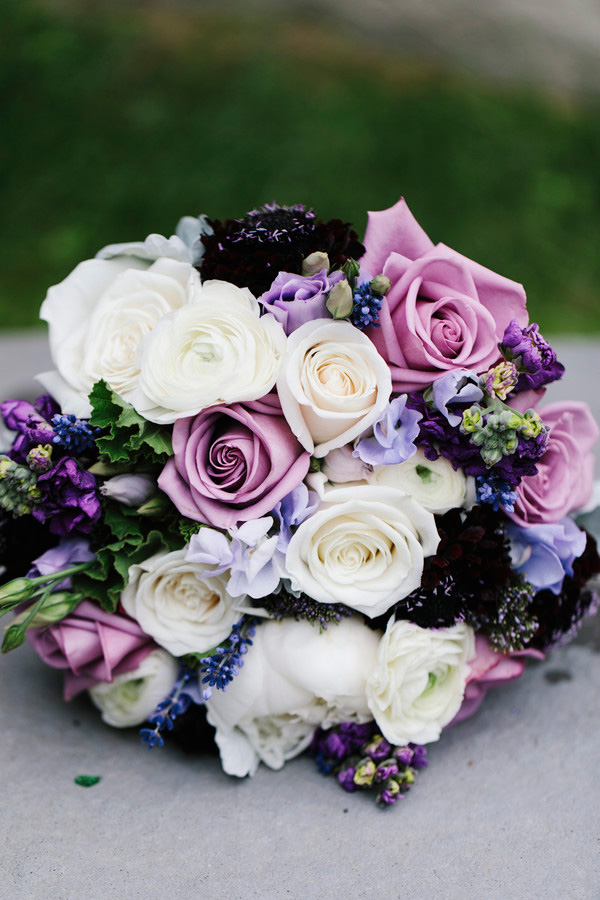 Purple, plum, and white roses in a bridal bouquet at a Vermont wedding venue