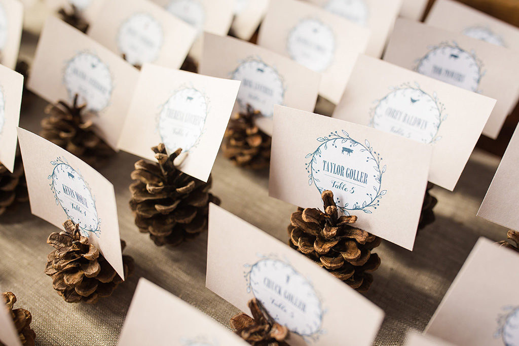 Pinecone place card holders for a rustic wedding