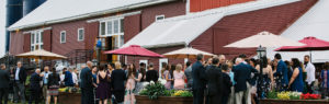 Guests on the Patio of The Barn at Boyden Farm's Event Venue