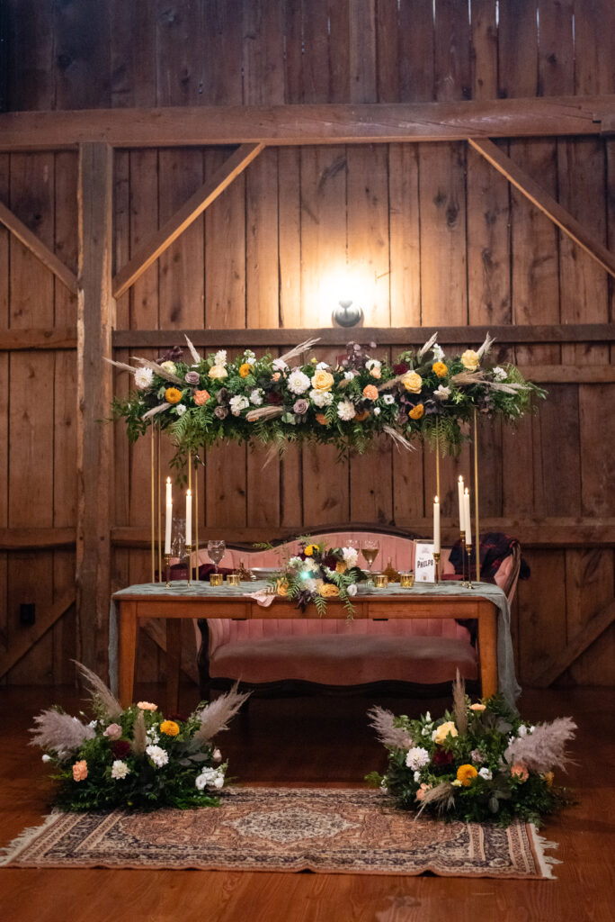 Fall wedding flower arrangements at a rustic barn wedding venue