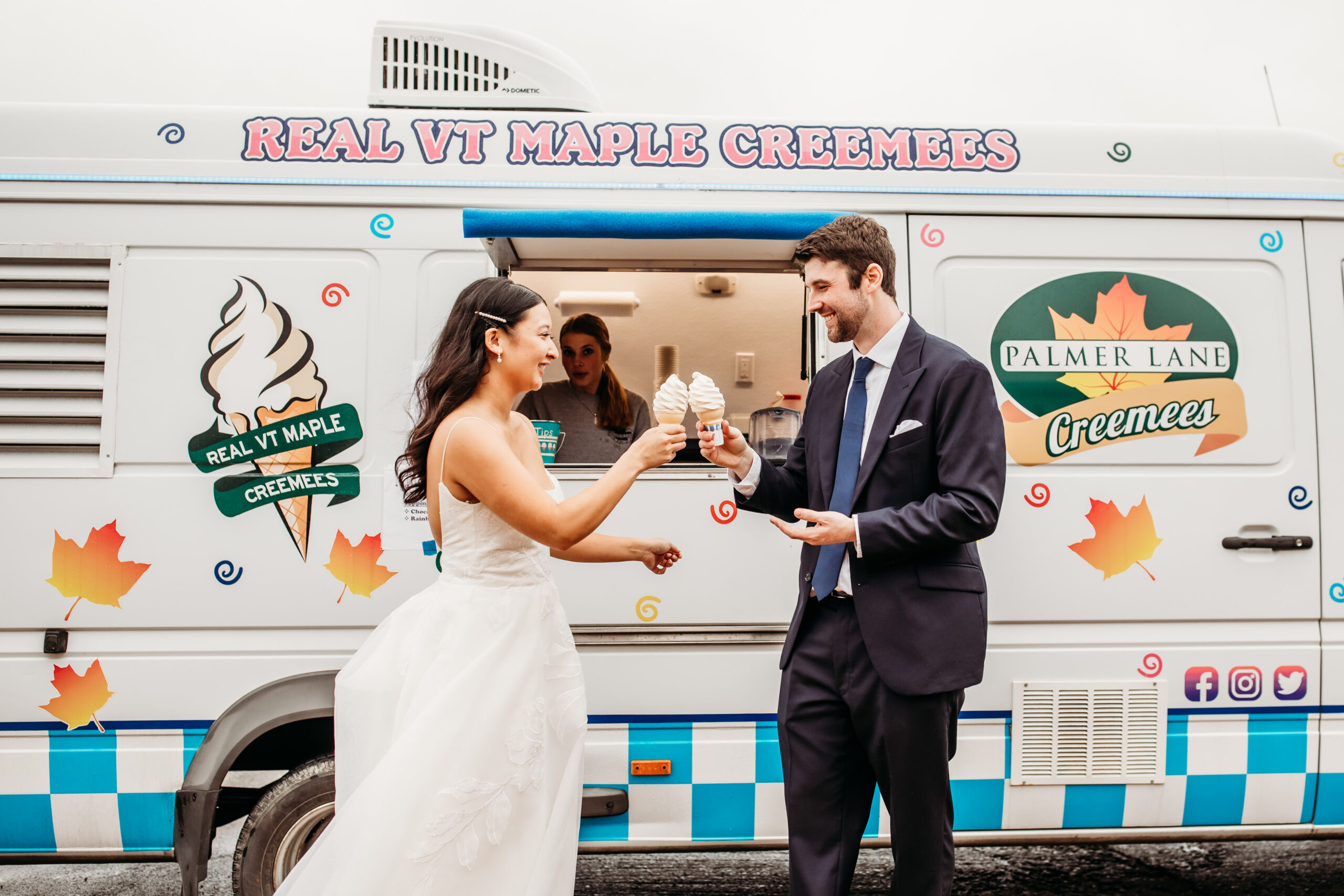 A couple enjoying Vermont maple creemees together from the Palmer Lane Maple creemee truck at their summer wedding in Vermont.