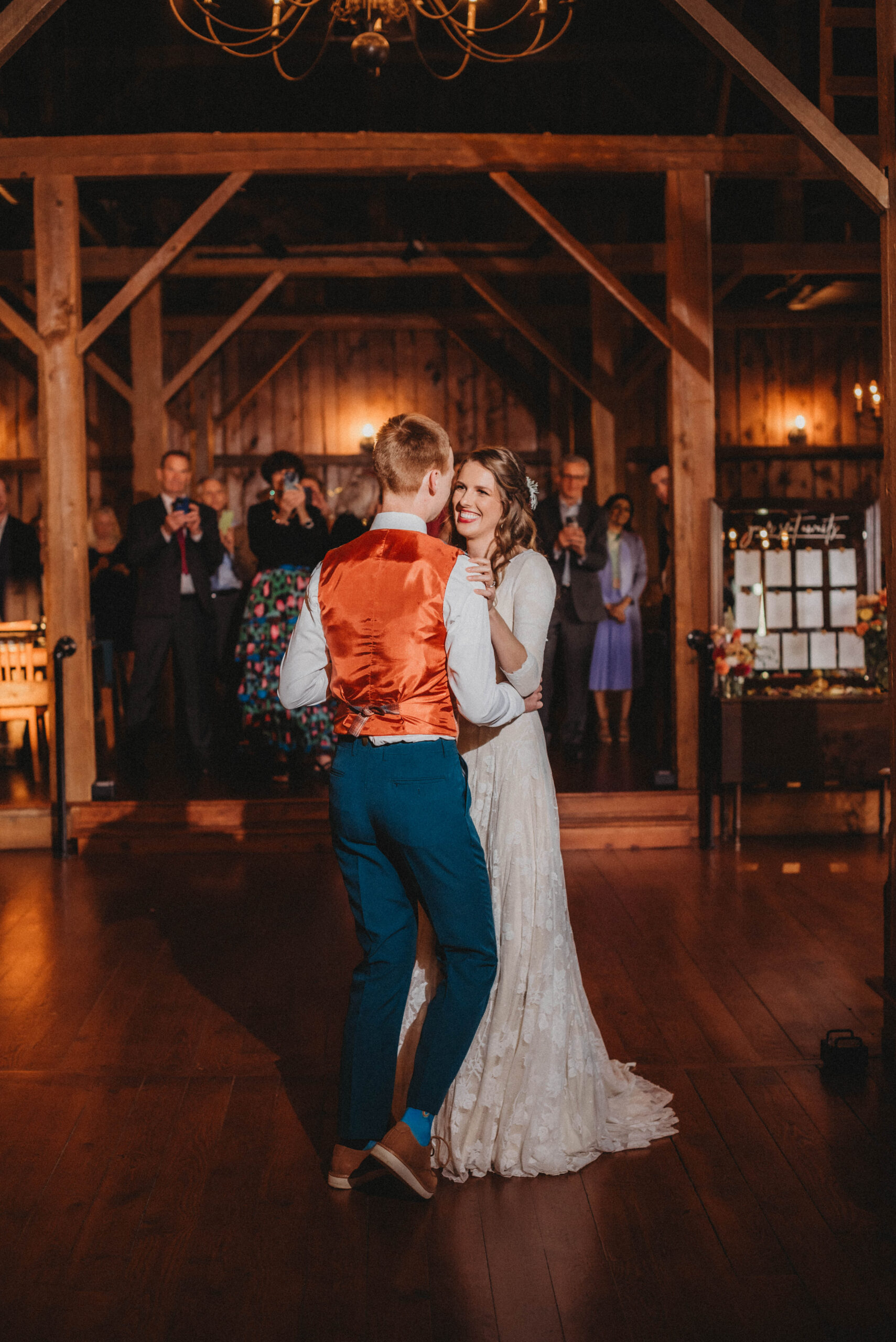 Emily and Sean sharing their first dance together inside the rustic barn venue