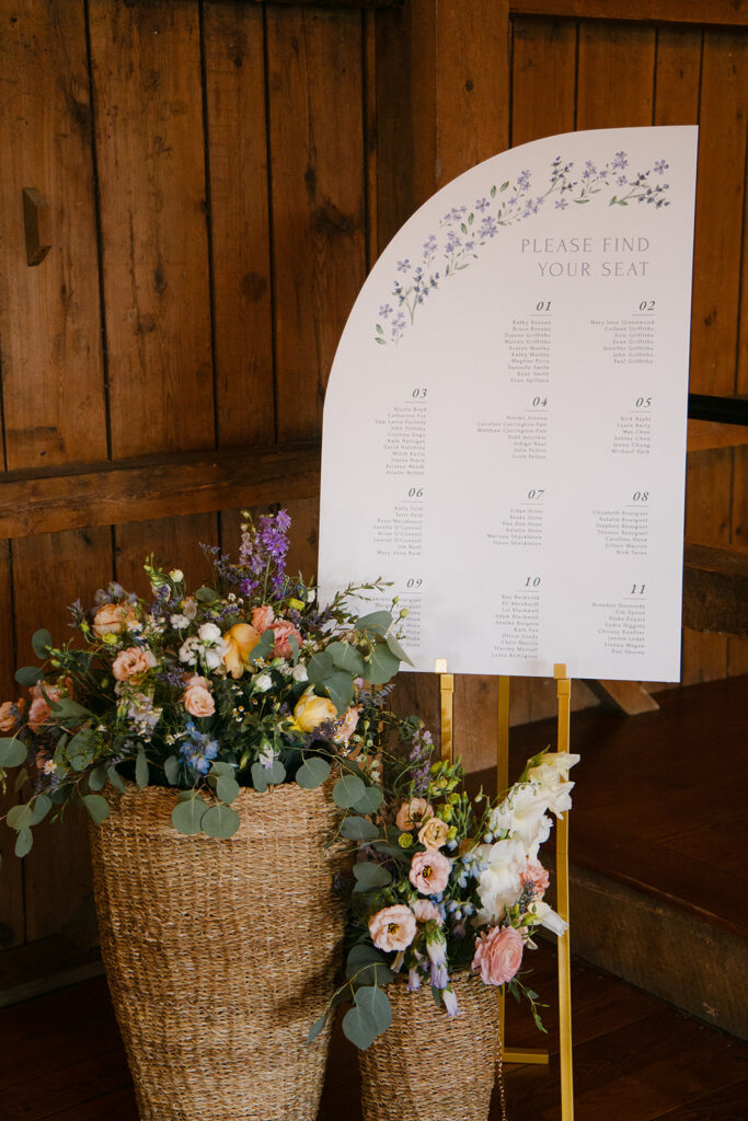 Flowers and seating chart from a wedding at The Barn at Boyden Farm planned by Green Mountain Gatherings